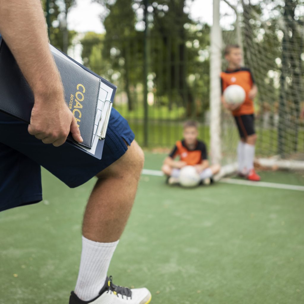 football-trainer-teaching-his-pupils