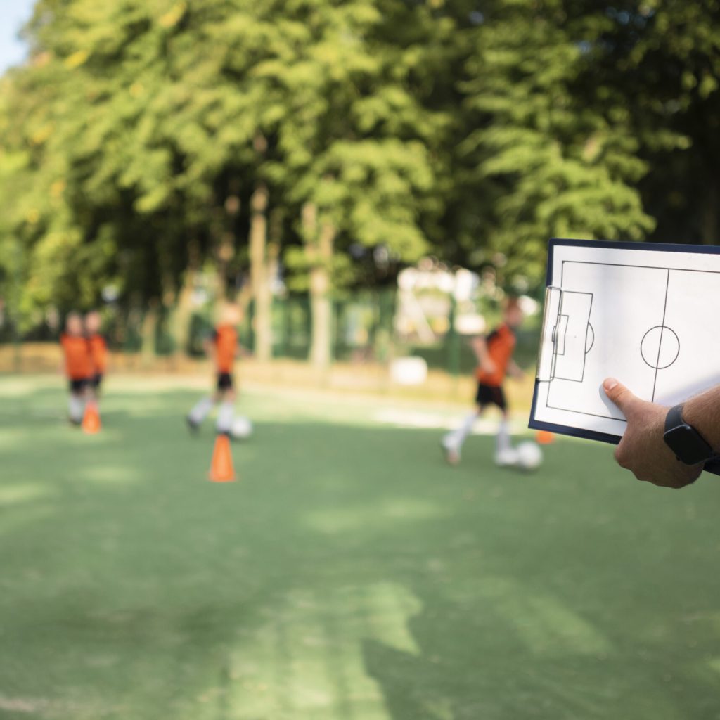 football-trainer-teaching-his-pupils(1)